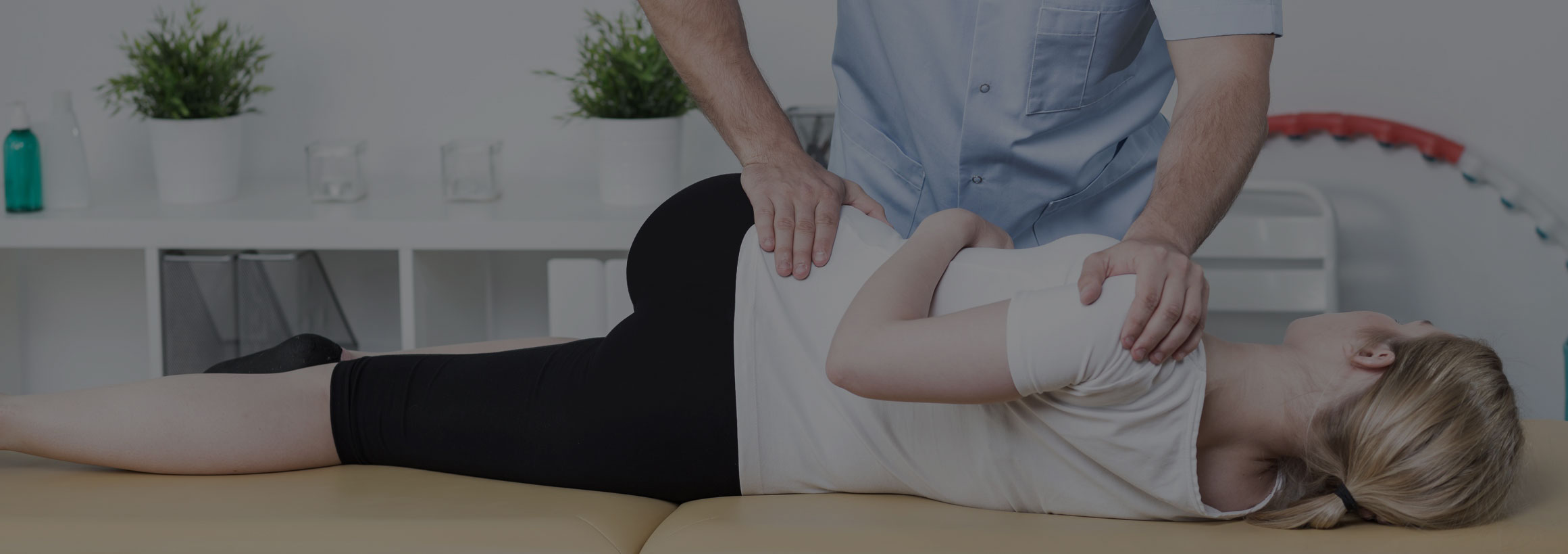 Chiropractor performing a spinal adjustment
