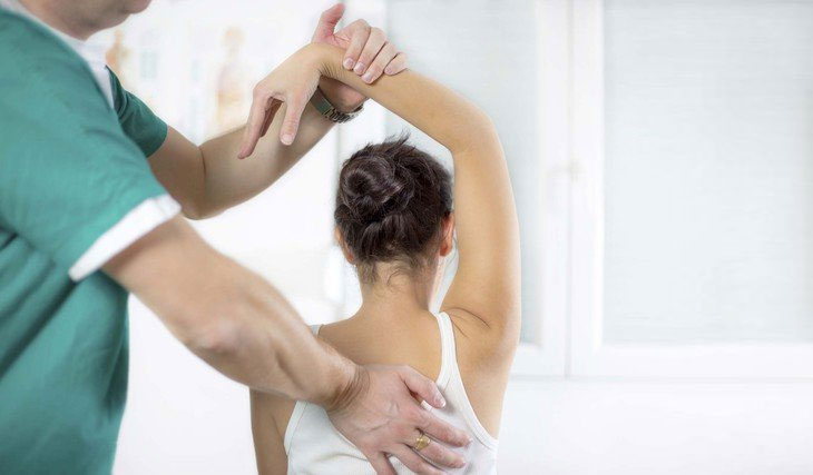 Chiropractor performing an adjustment